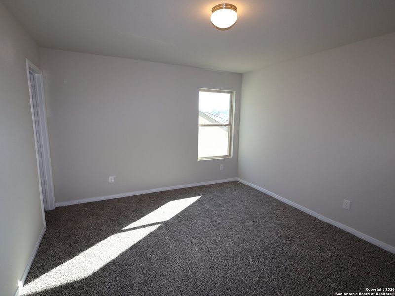 Spacious, unfurnished interior of a new home in Hunters Ranch, San Antonio (Image 12).