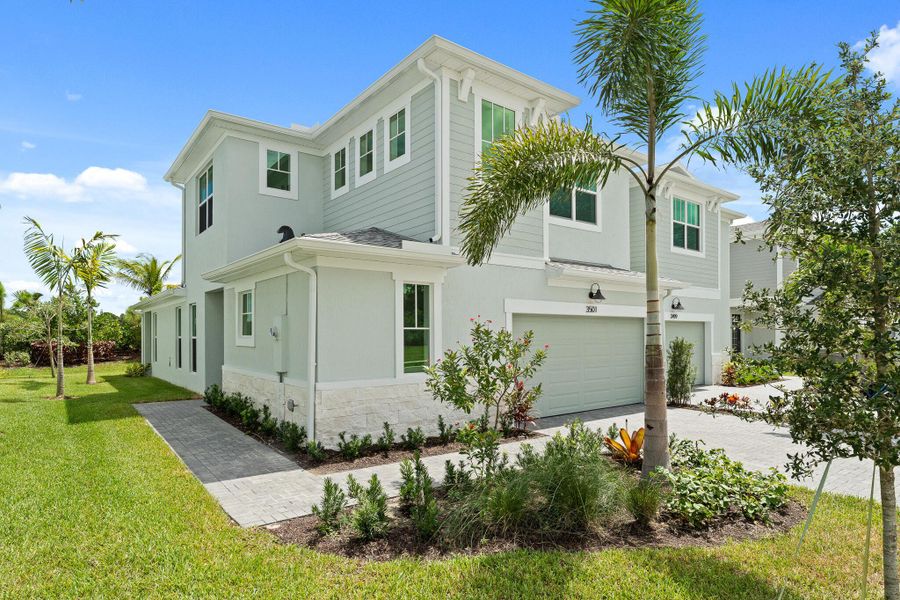 Front exterior of a new home in Avila, Jensen Beach, FL, highlighting curb appeal (Image 1).