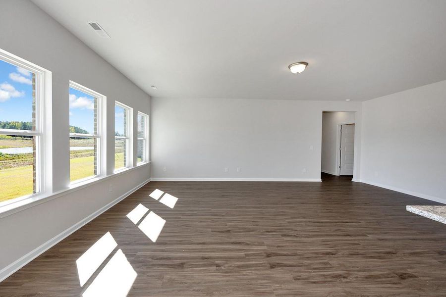The Avery- Breakfast Area into Family Room. Home under construction. Sample floor plan photo used for illustrative purposes only. Upgrades, selections options, and colors will vary.