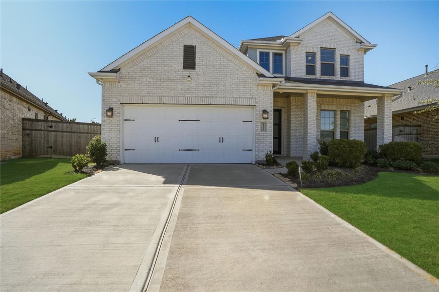 Front exterior of a new home in , Fulshear, TX, highlighting curb appeal (Image 2). Front exterior of a new home in , Fulshear, TX, highlighting curb appeal (Image 2).