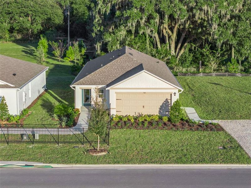 Front exterior of a new home in Avalon Park Tavares, Tavares, FL, highlighting curb appeal (Image 1).
