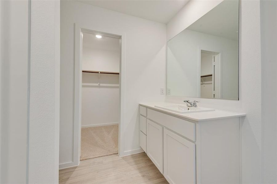 Bathroom featuring vanity and hardwood / wood-style flooring