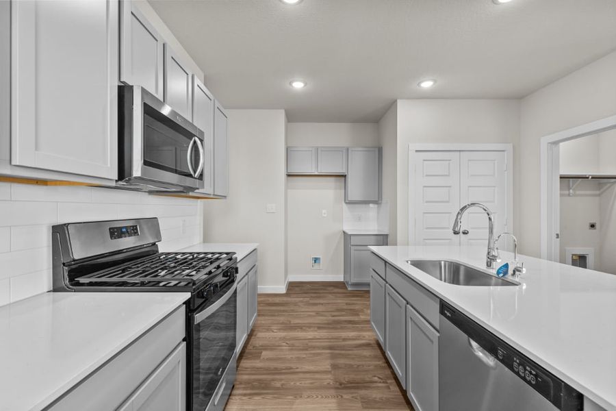 A kitchen with white cabinets. A kitchen with white cabinets.