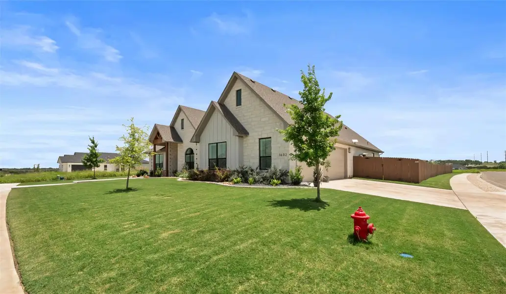 HALF ACRE CORNER lot with 3 car driveway and sidewalk access. HALF ACRE CORNER lot with 3 car driveway and sidewalk access.