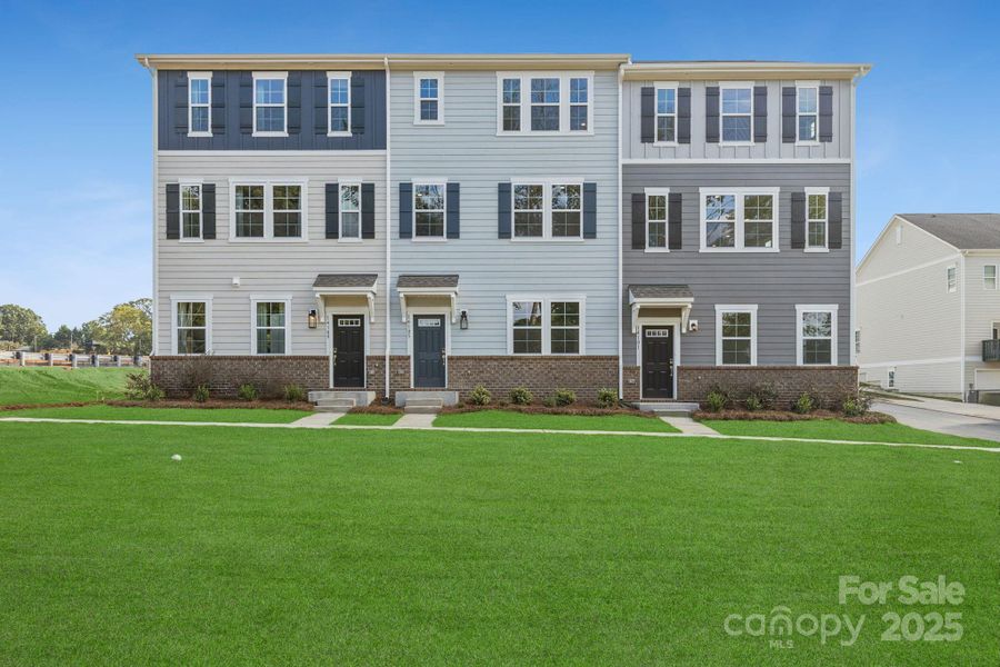 Front exterior of a new home in , Huntersville, NC, highlighting curb appeal (Image 1).