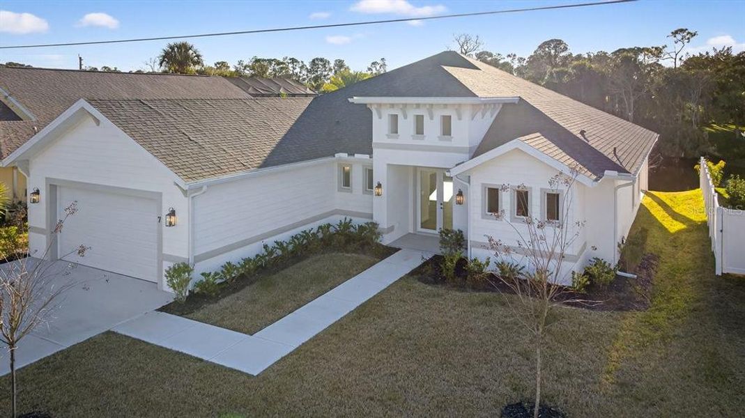 Front exterior of a new home in , Palm Coast, FL, highlighting curb appeal (Image 27).