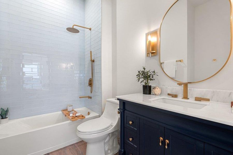 2nd full Bathroom with shower / bathtub combination, vanity, and dark wood-style flooring