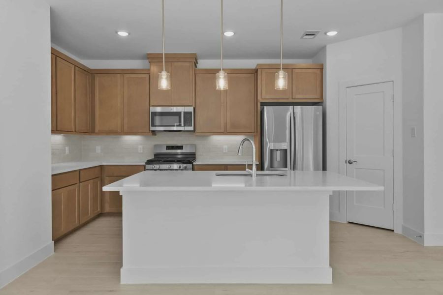 Representative furnished interior of a home built from the Chalet by Chesmar Homes in Meridiana Townhomes, Iowa Colony (Image 6).