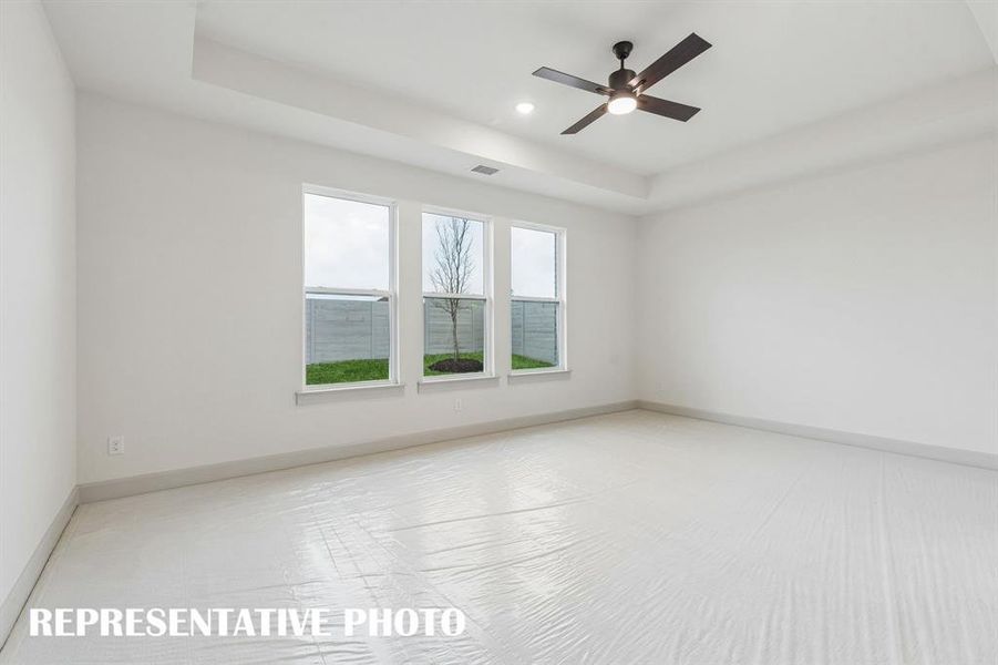 High ceilings, plush carpet and oversized windows create a peaceful and relaxing owner's suite. REPRESENTATIVE PHOTO High ceilings, plush carpet and oversized windows create a peaceful and relaxing owner's suite. REPRESENTATIVE PHOTO
