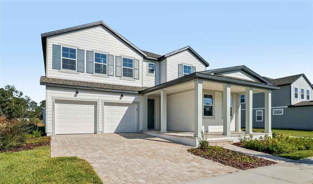 Front exterior of a new home in Northlake Traditional, Winter Garden, FL, highlighting curb appeal (Image 26).