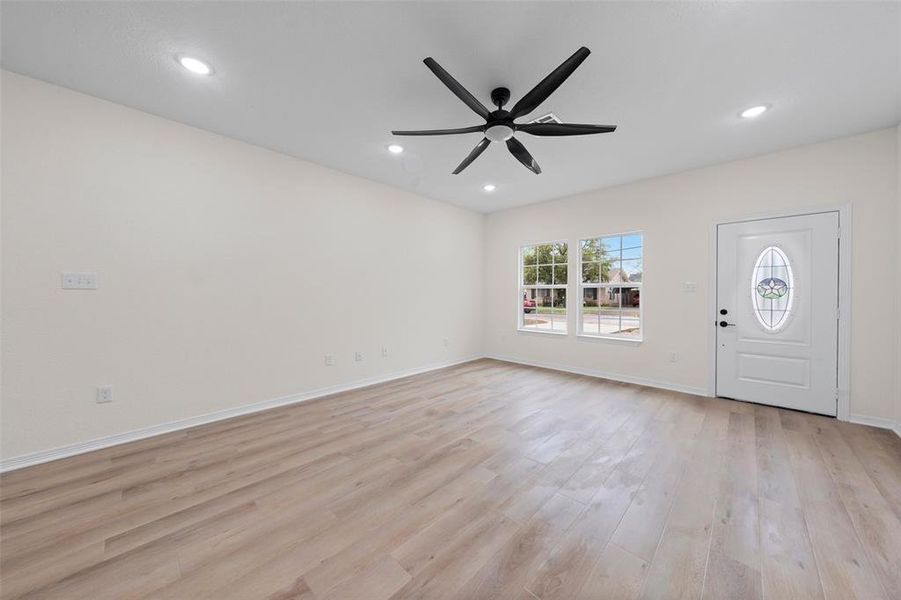 Entrance foyer featuring light wood-style floors, recessed lighting, and ceiling fan