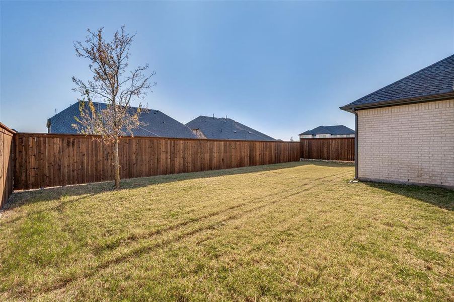View of privacy fenced in backyard View of privacy fenced in backyard