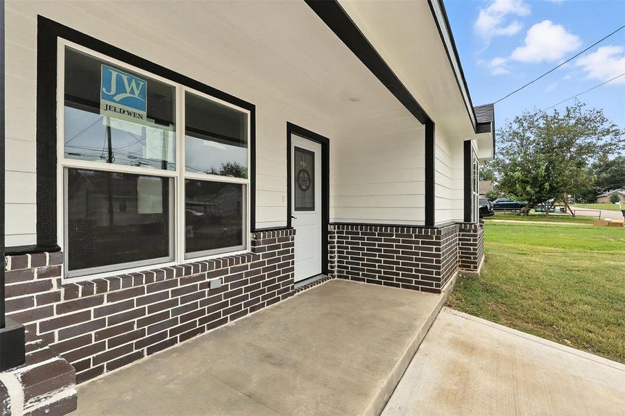 Porch featuring a lawn Porch featuring a lawn