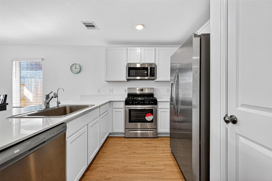 Furnished interior view inside a new home in Sunterra: Watermill Collection, Katy (Image 5).