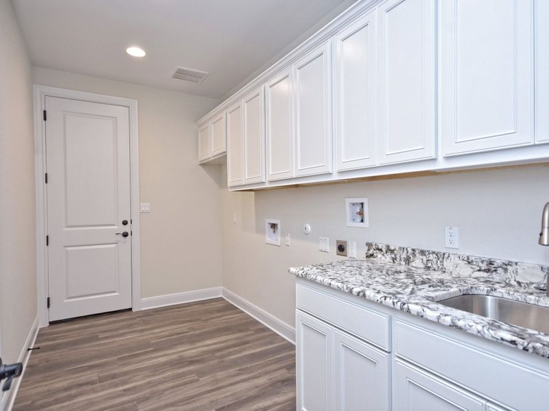 Representative furnished interior of a home built from the San Simeon I by Giddens Homes in Clearwater Ranch, Liberty Hill (Image 227).