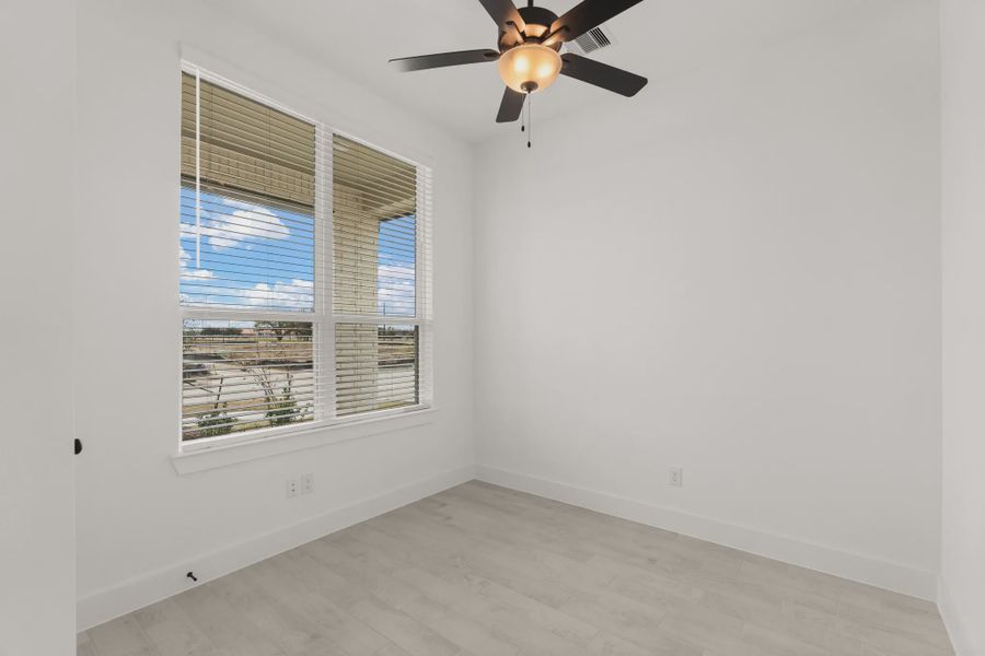 Representative unfurnished interior of a home built from the Pinehurst by Chesmar Homes in Riceland Alley Loads, Mont Belvieu (Image 12).