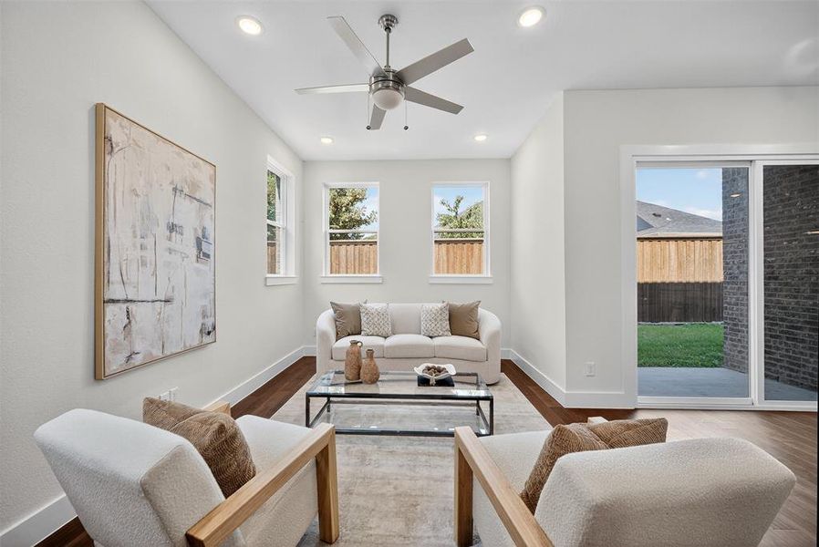 Living room featuring recessed lighting, wood finished floors, and a ceiling fan