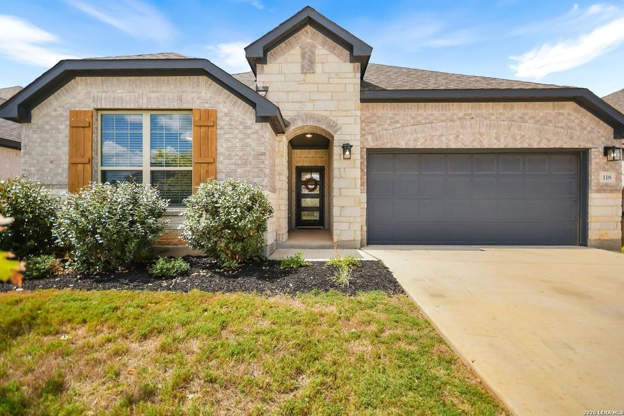 Front exterior of a new home in Corley Farms, Boerne, TX, highlighting curb appeal (Image 26). Front exterior of a new home in Corley Farms, Boerne, TX, highlighting curb appeal (Image 26).