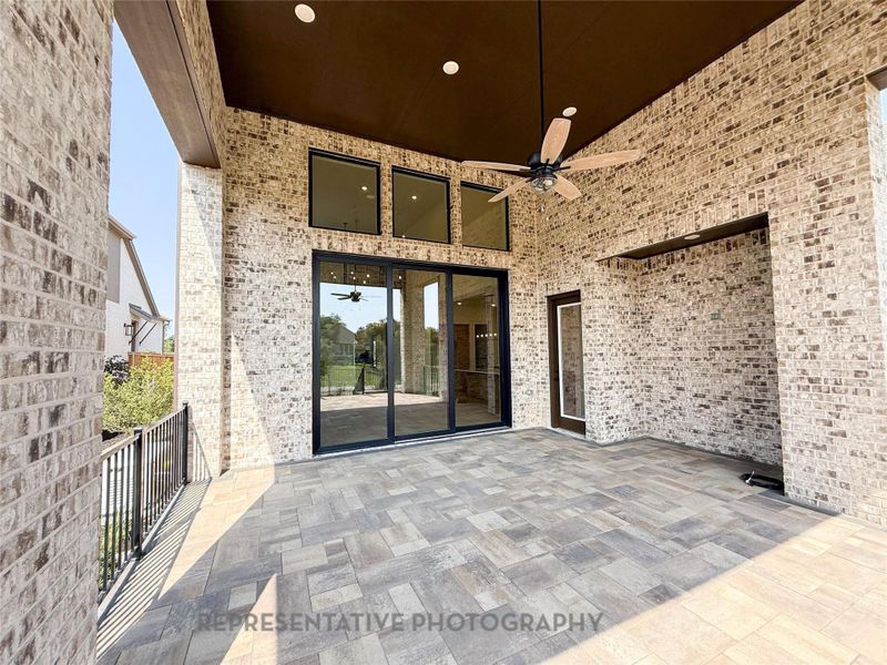 Large covered outdoor patio with windows in lieu of sliding glass doors Large covered outdoor patio with windows in lieu of sliding glass doors