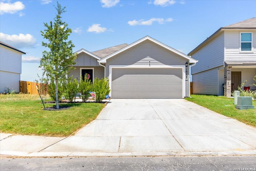 Front exterior of a new home in Redbird Ranch, San Antonio, TX, highlighting curb appeal (Image 25). Front exterior of a new home in Redbird Ranch, San Antonio, TX, highlighting curb appeal (Image 25).