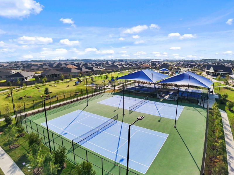 The community offers multiple tennis and pickleball courts surrounded by scenic views and open green spaces. Residents can stay active while enjoying the sunshine and a friendly match right in their neighborhood.