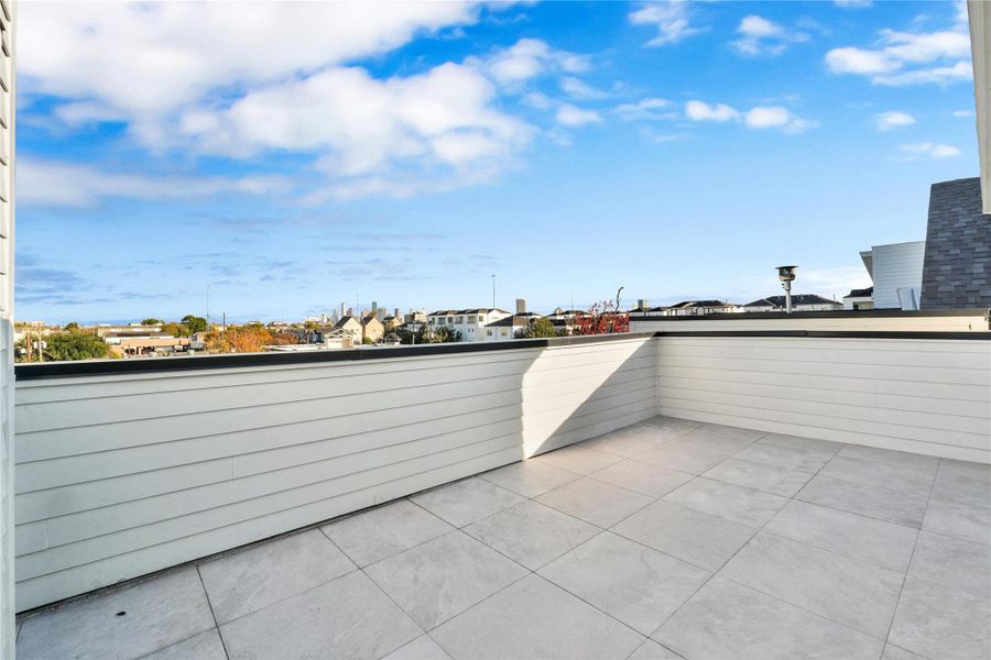 Rooftop terrace with downtown views. Enjoy gatherings in this beautiful outdoor space, complete with gas and power connections for a grill or outdoor kitchen.