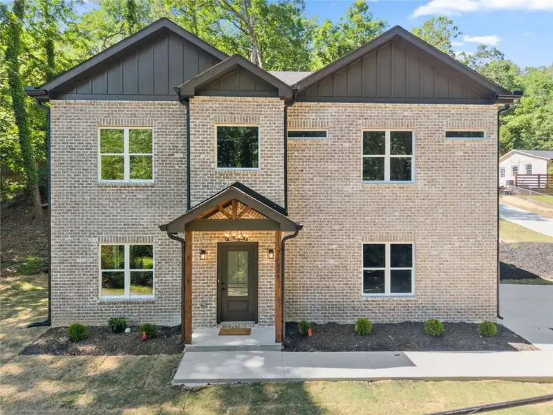 Front exterior of a new home in , Gainesville, GA, highlighting curb appeal (Image 23).
