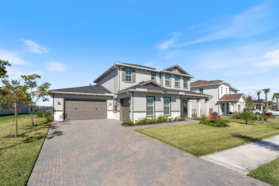Front exterior of a new home in , The Acreage, FL, highlighting curb appeal (Image 21). Front exterior of a new home in , The Acreage, FL, highlighting curb appeal (Image 21).