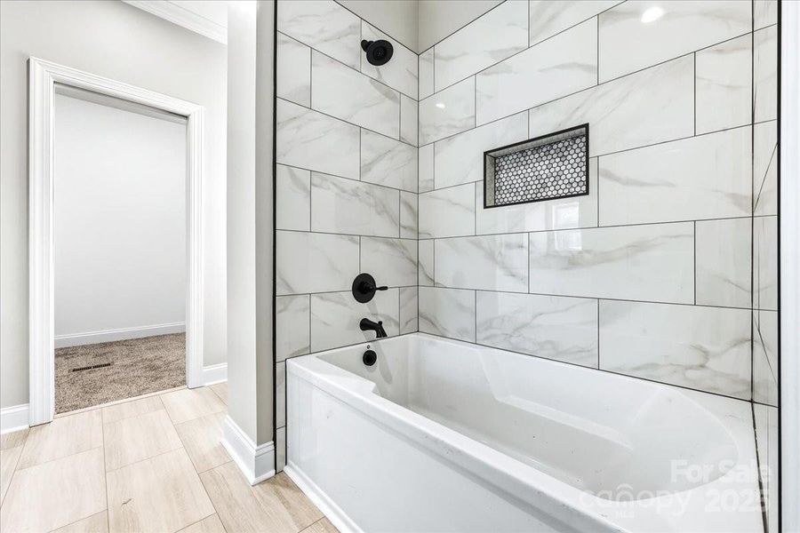 Large MTI tub with gorgeous tile surround Large MTI tub with gorgeous tile surround