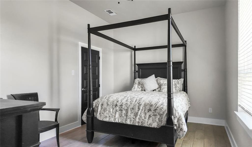 Bedroom featuring wood finished floors