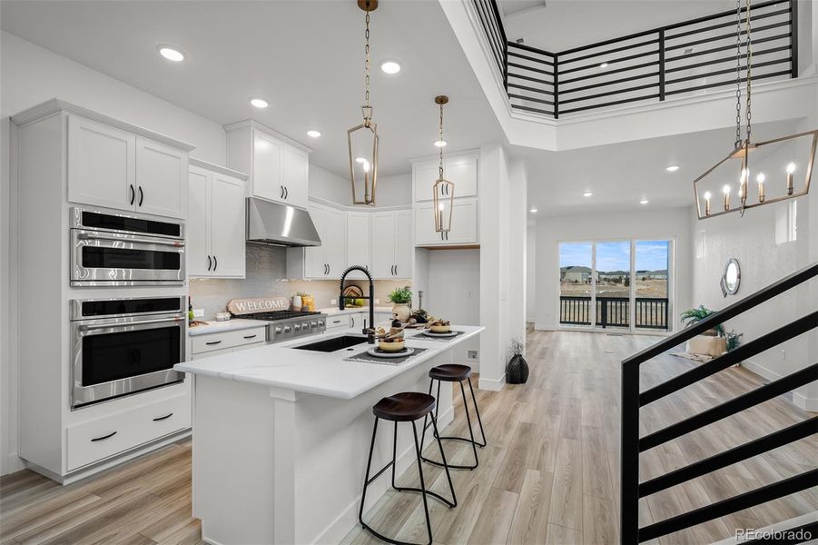 Furnished interior view inside a new home in Revel Crossing at Wolf Ranch - The Panorama Collection, Colorado Springs (Image 8).