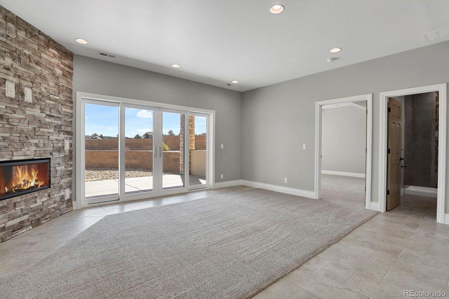 Family room in basement w/ double slider to patio