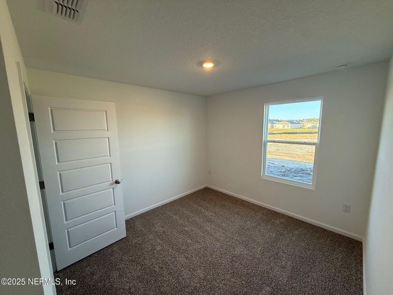 Spacious, unfurnished interior of a new home in The Arbors, Jacksonville (Image 37).