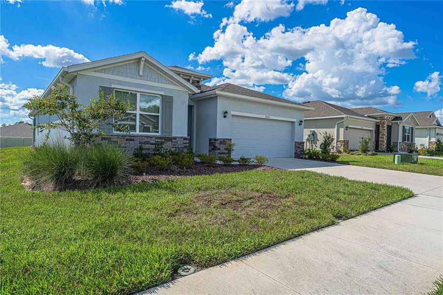 Front exterior of a new home in JB Ranch, Ocala, FL, highlighting curb appeal (Image 26).