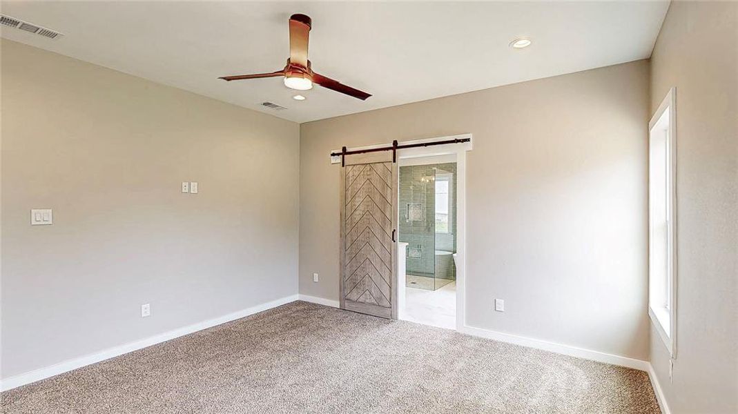 Primary suite with remote ceiling fan controls & wall mount flat screen power & data outlets