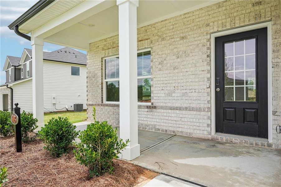 Exterior details and patio area of a home in Northwoods at Mirror Lake, Villa Rica (Image 4).