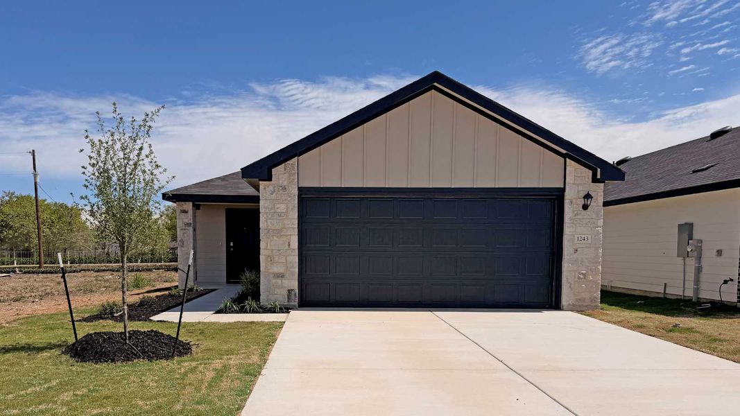Front exterior of a new home in Spring Valley, New Braunfels, TX, highlighting curb appeal (Image 1). Front exterior of a new home in Spring Valley, New Braunfels, TX, highlighting curb appeal (Image 1).