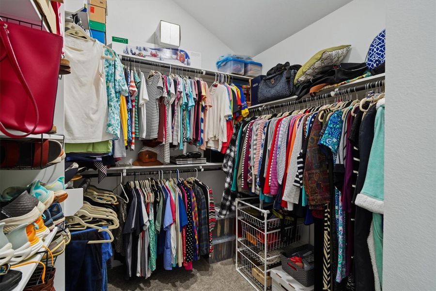 One of two walk in closets in the primary en suite One of two walk in closets in the primary en suite