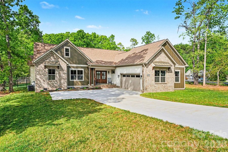 Front exterior of a new home in , Denver, NC, highlighting curb appeal (Image 21).