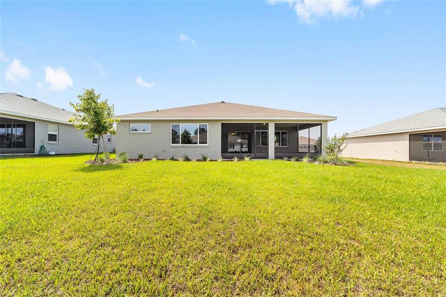 Exterior details and patio area of a home in On Top of the World Communities, Ocala (Image 3).