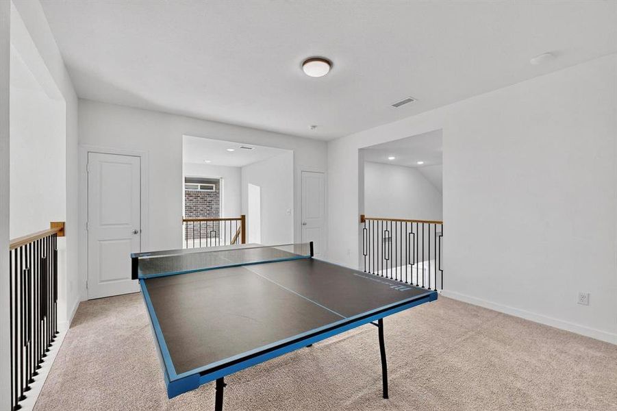 Rec room with light colored carpet and recessed lighting Rec room with light colored carpet and recessed lighting