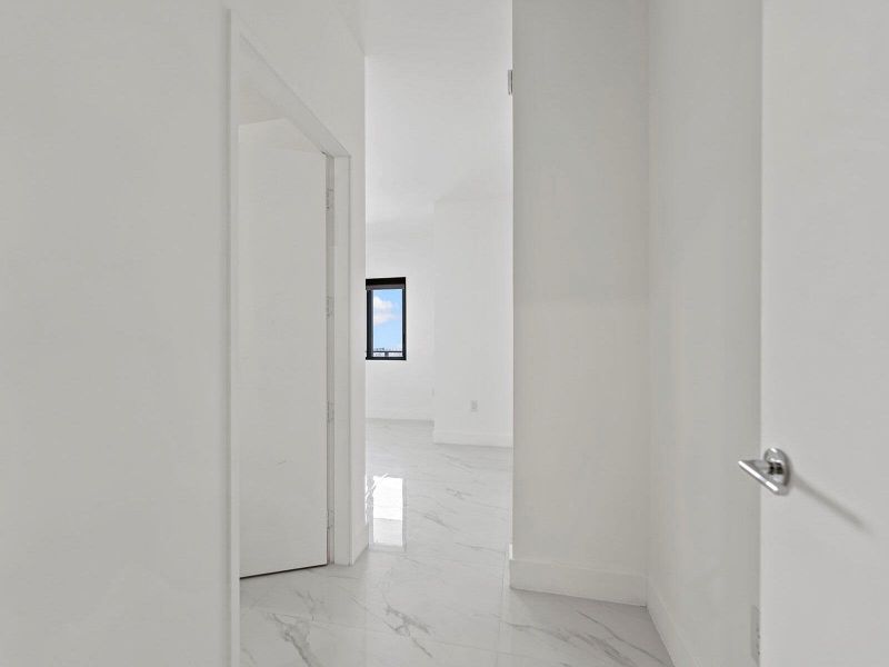 Spacious, unfurnished interior of a new home in Aria Reserve, Miami (Image 26). Spacious, unfurnished interior of a new home in Aria Reserve, Miami (Image 26).