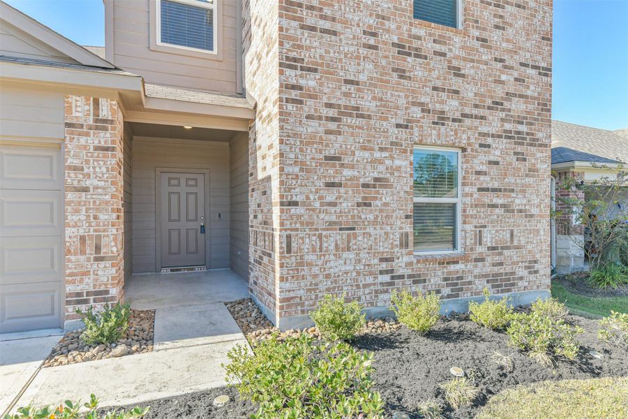 Exterior details and patio area of a home in Harrington Trails at The Canopies, New Caney (Image 25).