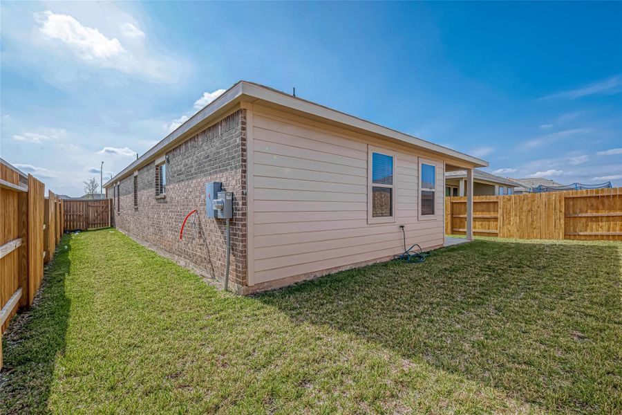 Exterior details and patio area of a home in Sunterra, Katy (Image 26). Exterior details and patio area of a home in Sunterra, Katy (Image 26).