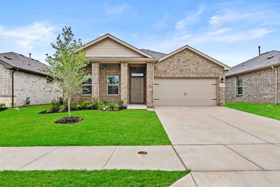 Front exterior of a new home in Terra Trace, Fort Worth, TX, highlighting curb appeal (Image 2). Front exterior of a new home in Terra Trace, Fort Worth, TX, highlighting curb appeal (Image 2).