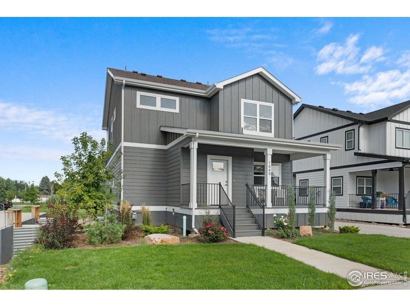 Front exterior of a new home in Taft Gardens, Loveland, CO, highlighting curb appeal (Image 28).