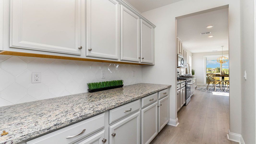 Furnished interior view inside a new home in Brunswick Plantation, Ash (Image 10).