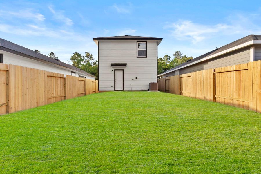 Exterior details and patio area of a home in William Trails, Willis (Image 15). Exterior details and patio area of a home in William Trails, Willis (Image 15).