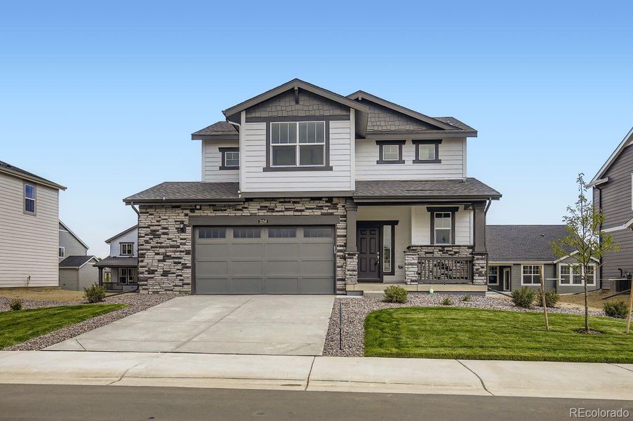 Front exterior of a new home in Riano Ridge: The Pioneer Collection, Loveland, CO, highlighting curb appeal (Image 2).