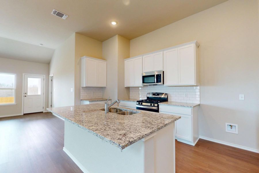 Furnished interior view inside a new home in Carillon, Manor (Image 8).